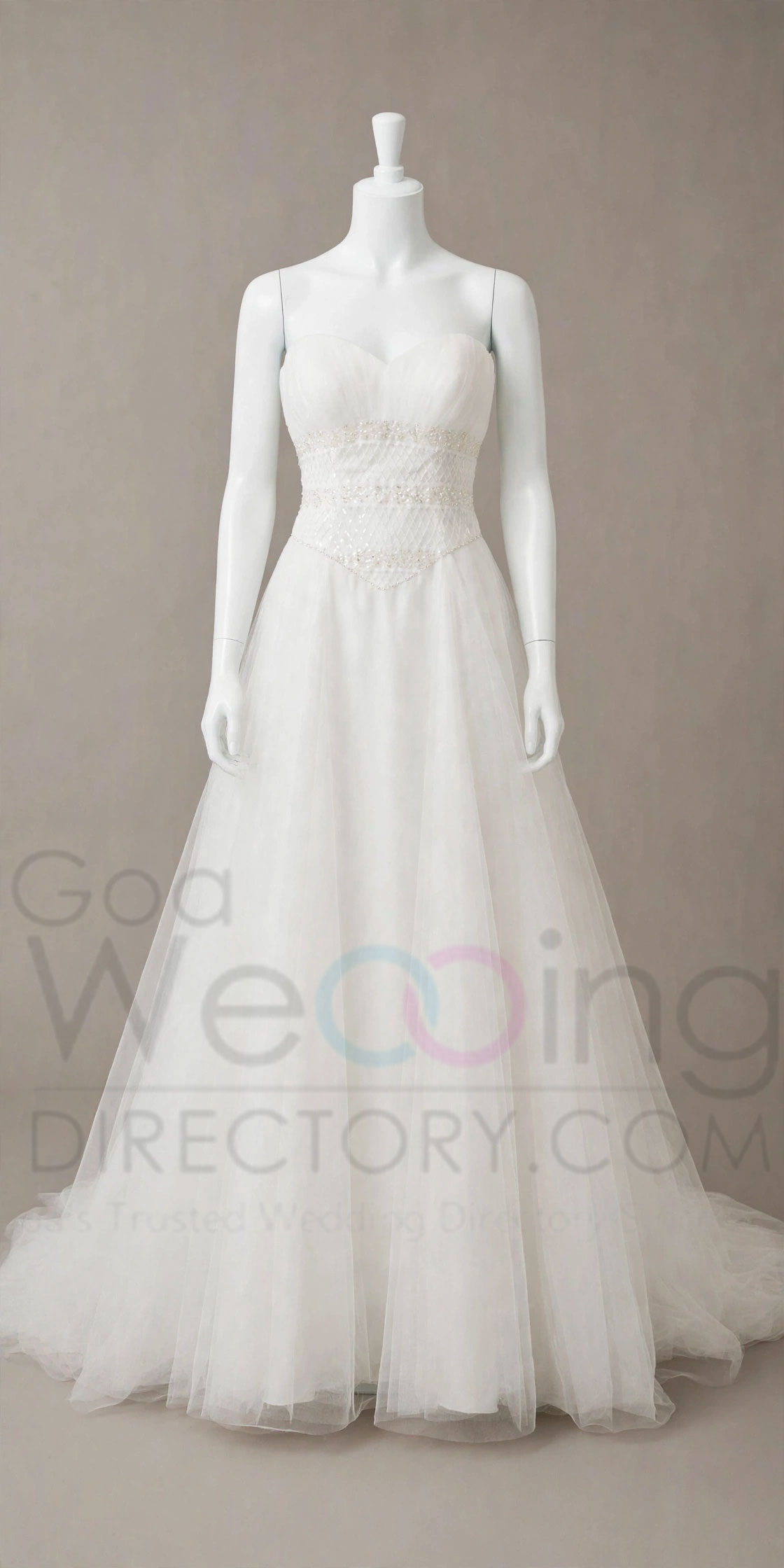 white wedding gown with trail on rent